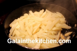 Potatoes frying Photo