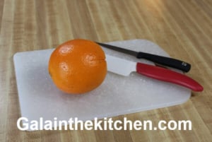 Orange on cutting board